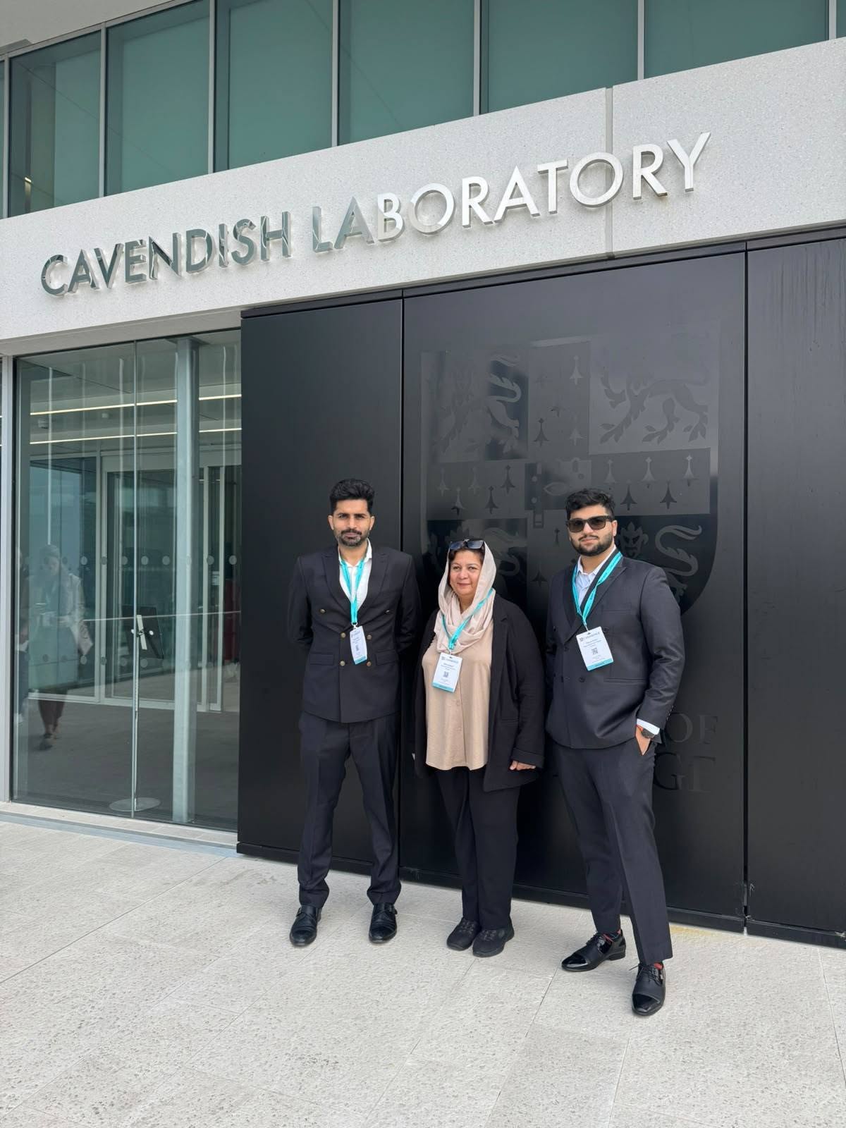 Mr Muhammad Hassan Khan, Mrs Atika Zubairi and Mr Muhammad Faizan Khan outside the Cavendish Laboratory during the Cambridge Schools Conference 2026