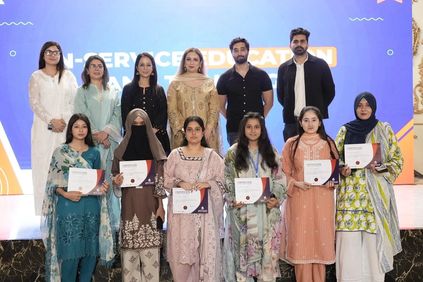 A group of educators with their INSET certificates