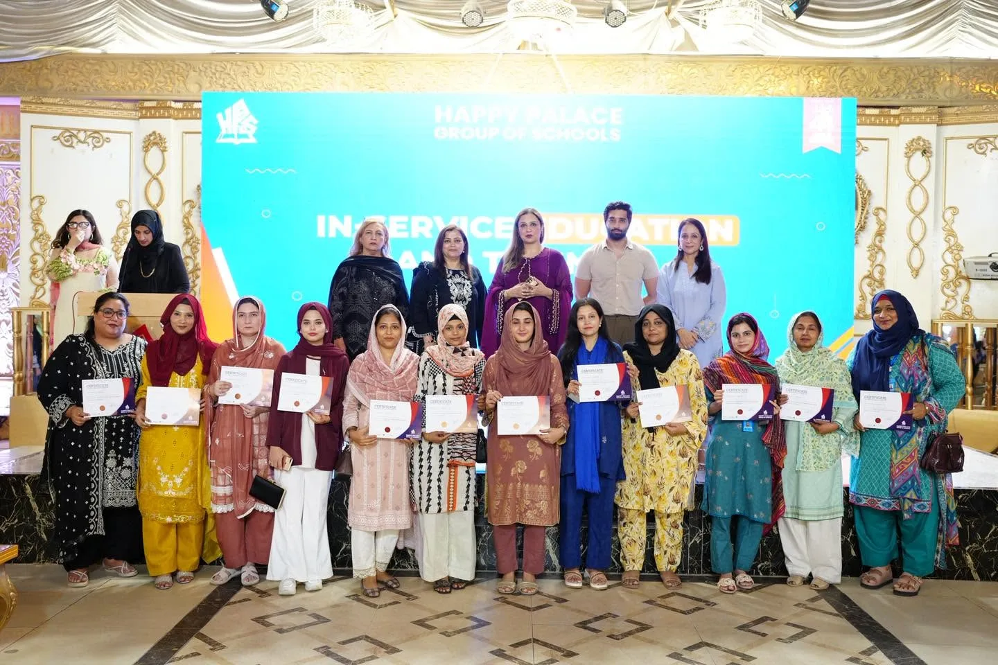 Educators holding certificates after a professional learning session