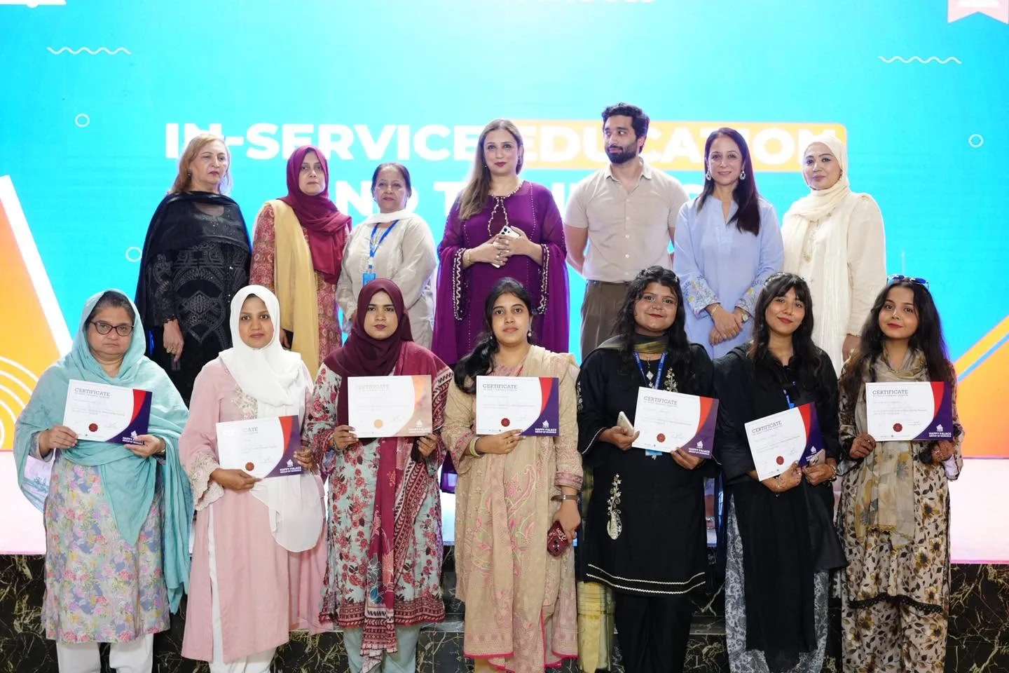 A group of HPGS educators with completion certificates