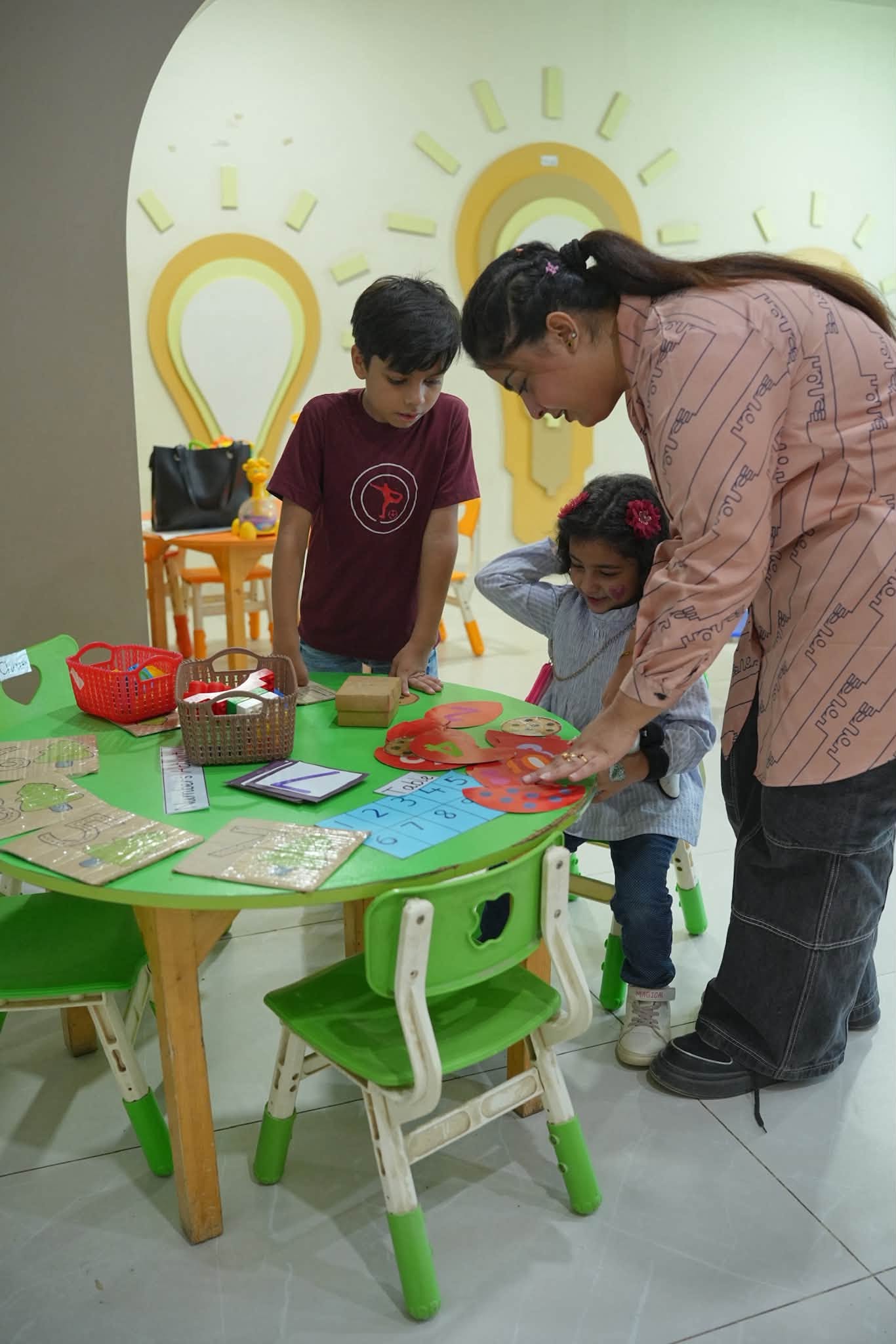 A family exploring an early years activity at HPGS