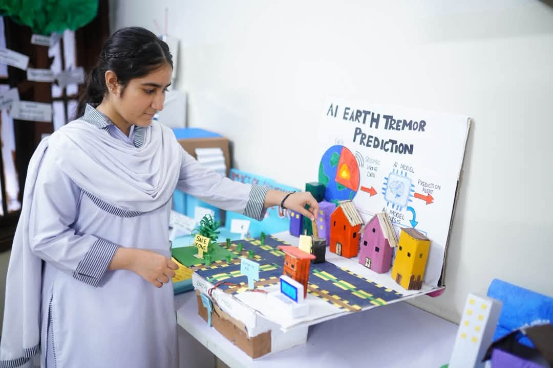 An HPGS student demonstrating an innovative model