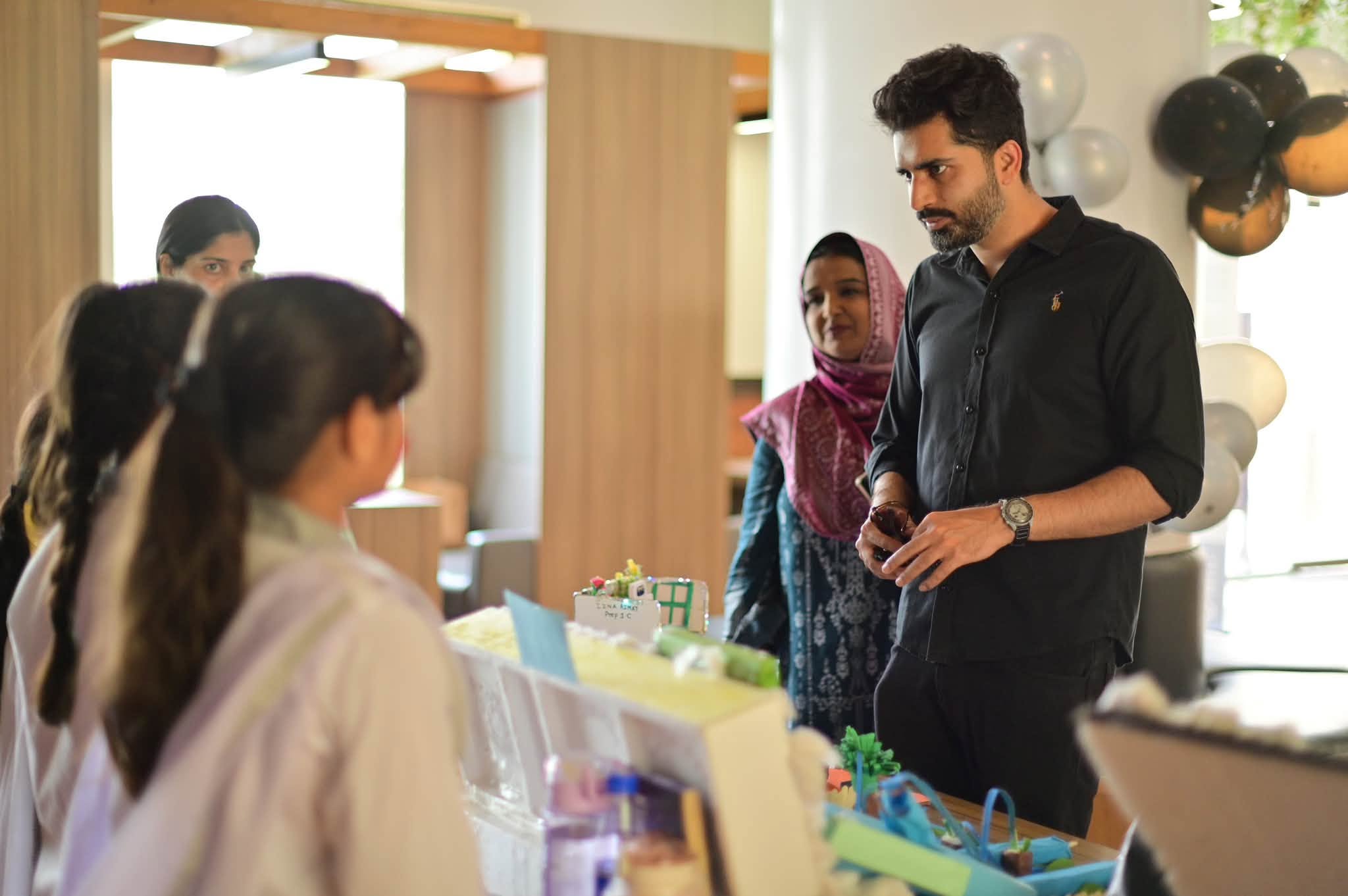 A student explaining a project to Open House visitors