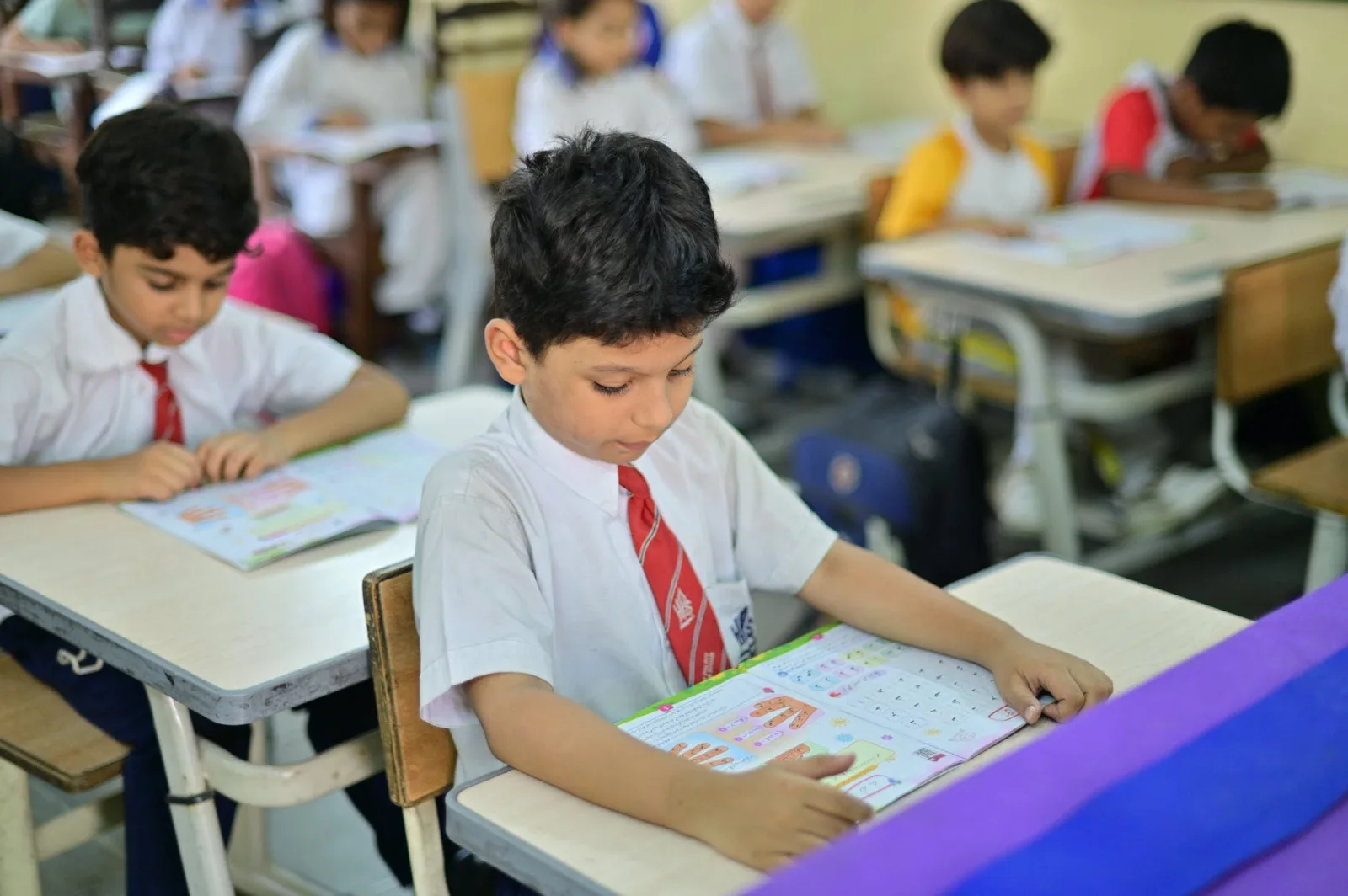 Primary Years student completing a Leader in Me workbook activity