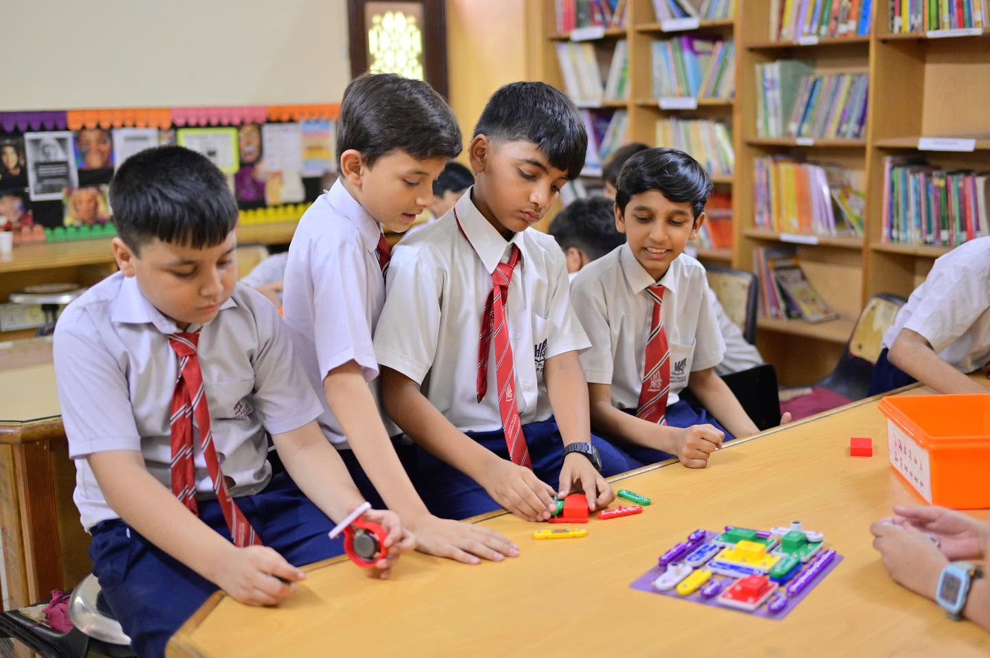 HPGS students collaborating during a hands-on electronics and robotics session